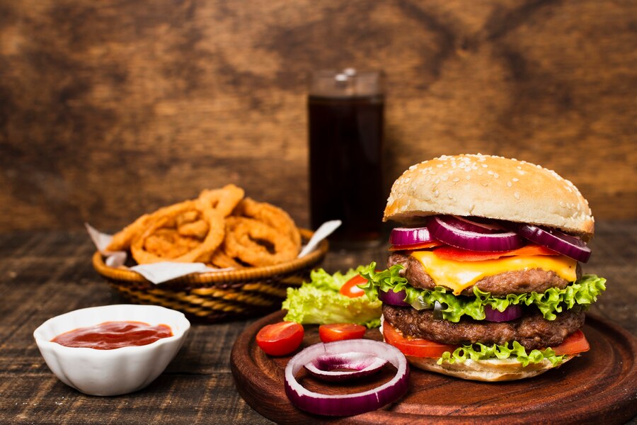close-up-burger-with-soda-onion-rings