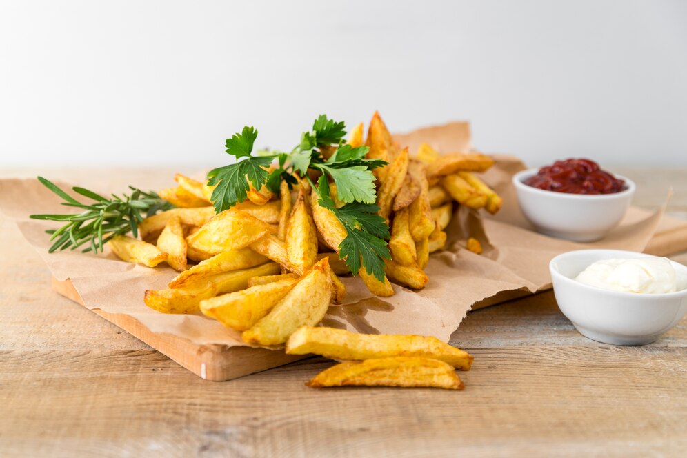 yummy-french-fries-with-mayonnaise-wooden-table