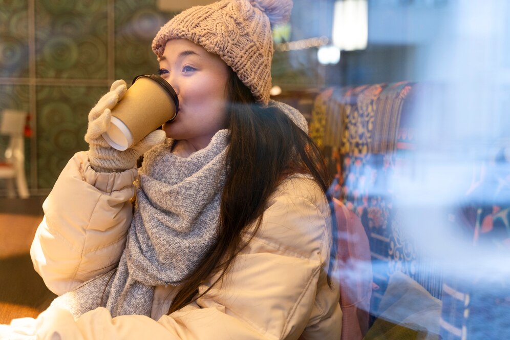 young-woman-drinking-hot-beverage