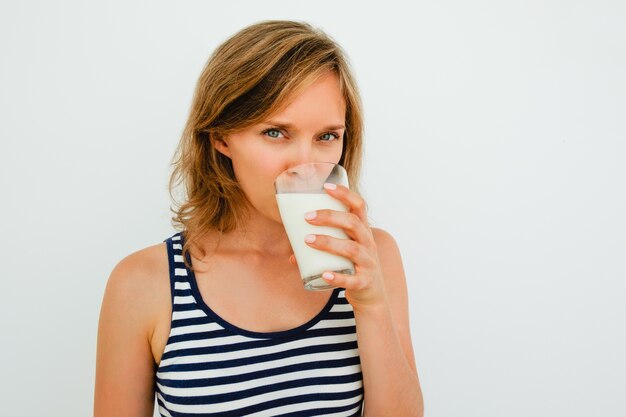 attractive-young-woman-drinking-milk-from-glass